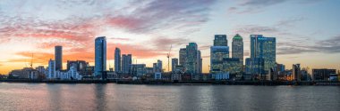 Panorama of Isle of Dogs and Canary Wharf in London at sunset clipart