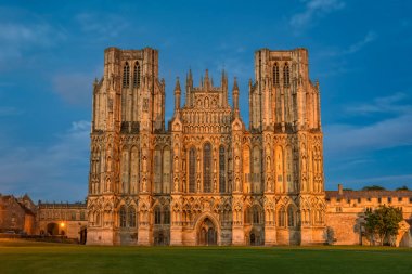 West front of Wells Cathedral at night clipart