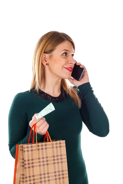 Kobieta na telefon podczas zakupów świątecznych — Zdjęcie stockowe