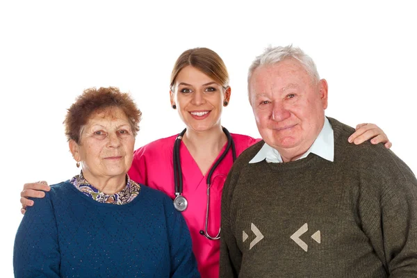 Aging couple with their kind assistant — Stock Photo, Image