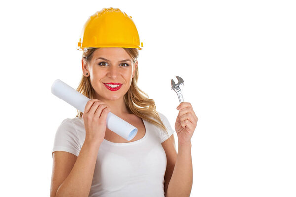 Attractive female engineer with house-project in her hands