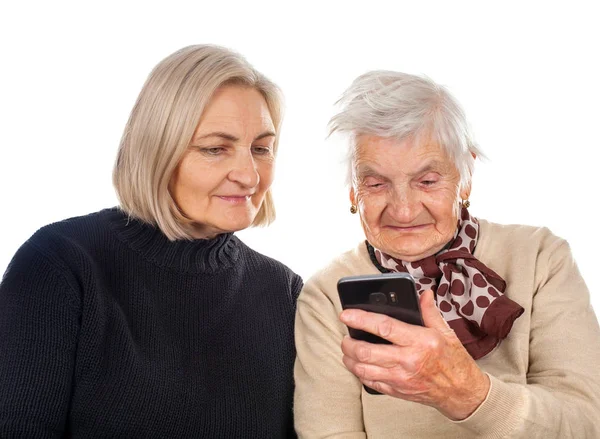 Elderly woman texting on the phone — Stock Photo, Image