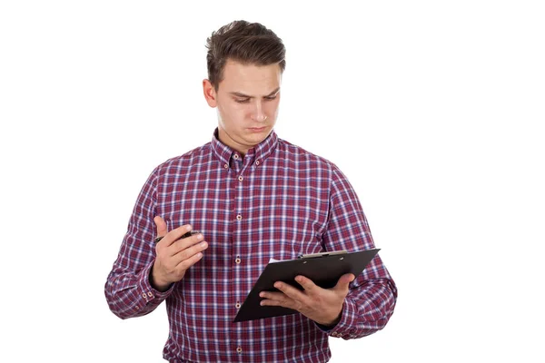 Thoughtful young man doing paperwork — Stock Photo, Image