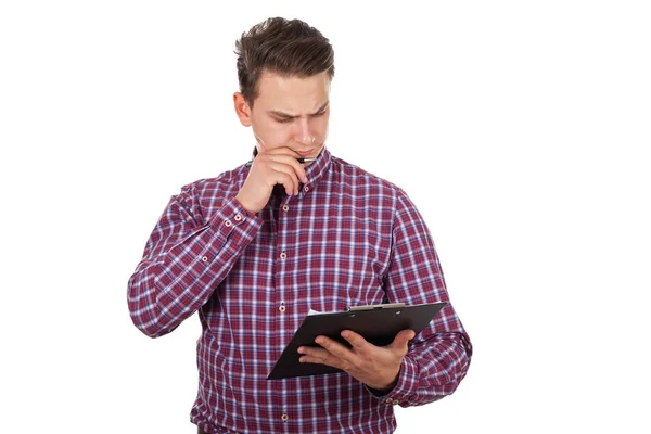 Thoughtful young man doing paperwork — Stock Photo, Image