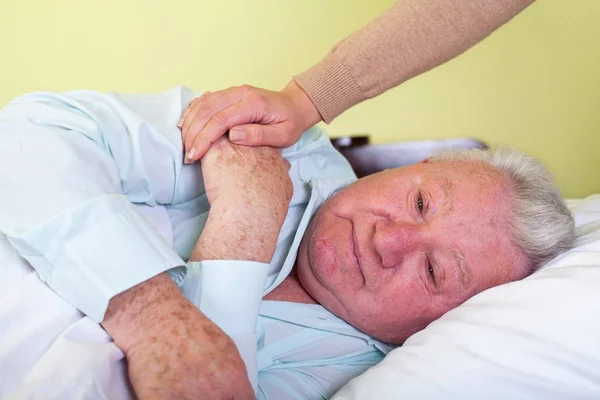 Depressed old man in bed — Stock Photo, Image