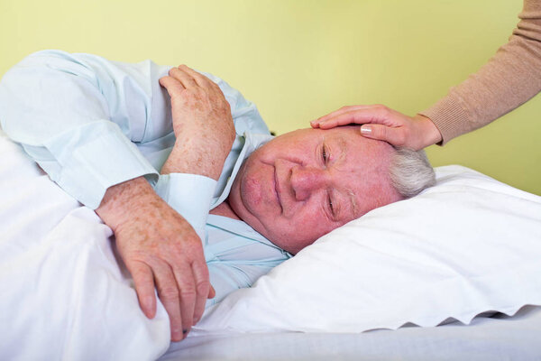 Agonized elderly man