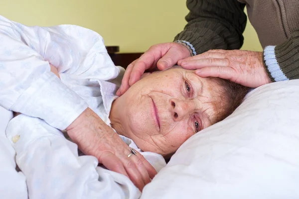 Bedriedden elderly woman — Stock Photo, Image