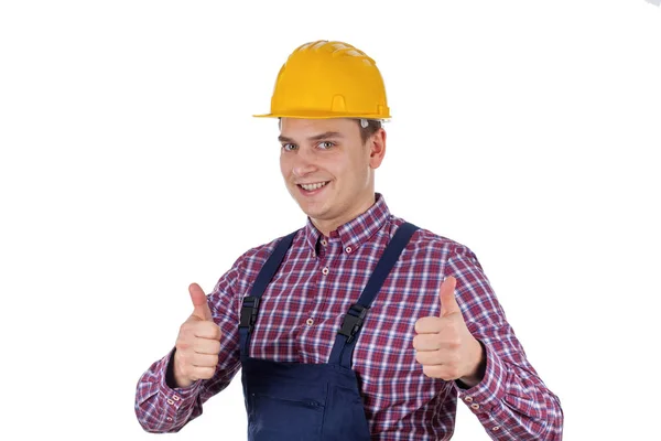 Sorrindo jovem engenheiro mostrando polegar para cima — Fotografia de Stock