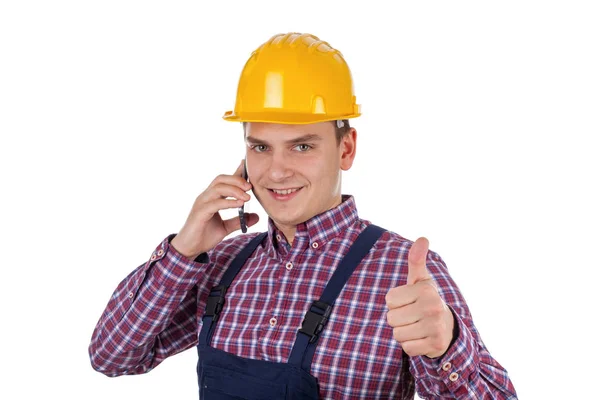 Jovem construtor no telefone — Fotografia de Stock