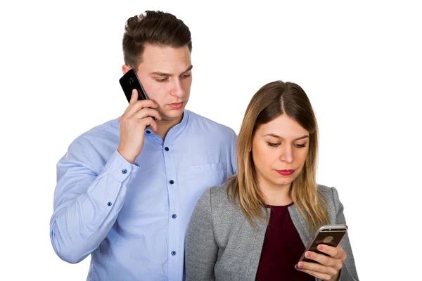 Young couple on the phone - isolated — Stock Photo, Image