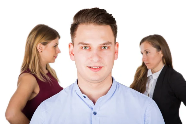 Confused young man with jealous women — Stock Photo, Image