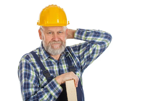 Trött manliga ingenjör håller en ribba - isolerade bakgrund — Stockfoto