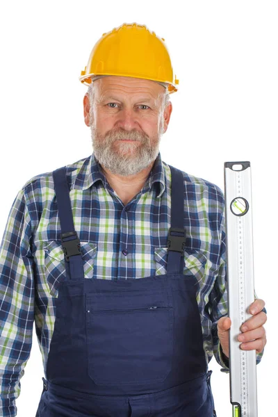 Constructor de edad avanzada con herramienta de nivel espiritual — Foto de Stock