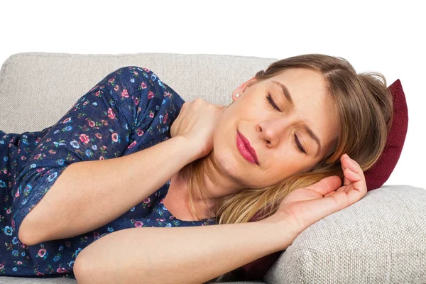Woman on the couch having a headache — Stock Photo, Image