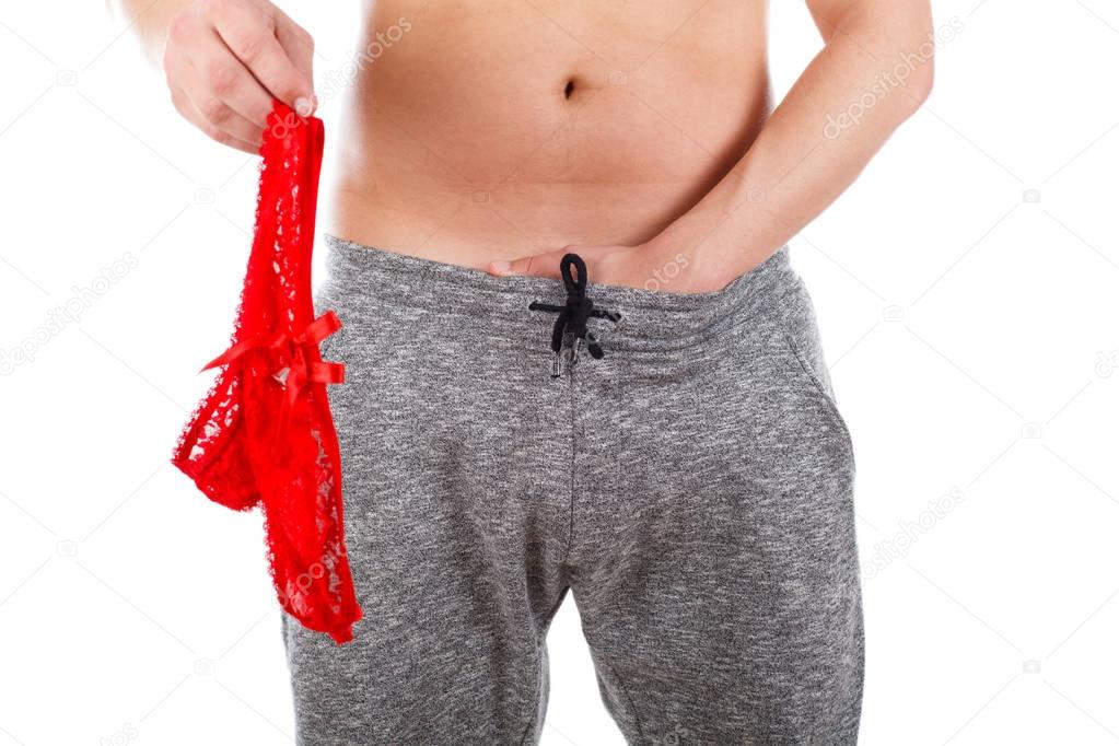 Man holding a red thong and masturbating