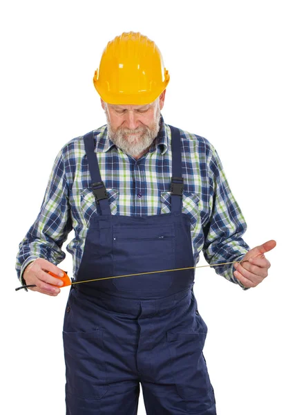 Mayores constructor sosteniendo utensilios — Foto de Stock