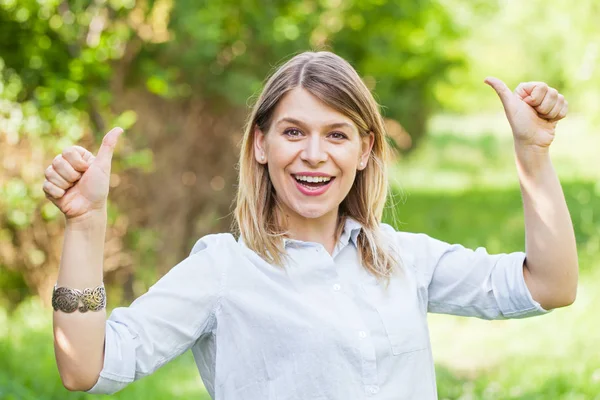 Gorgeous young lady showing thumbs up — Stock Photo, Image