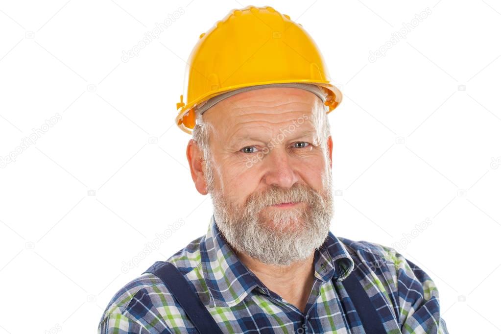 Elderly builder holding utensils