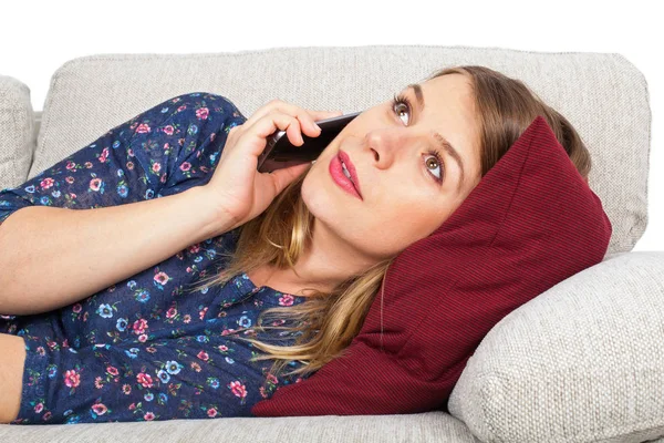 Woman on couch, talking on the phone — Stock Photo, Image