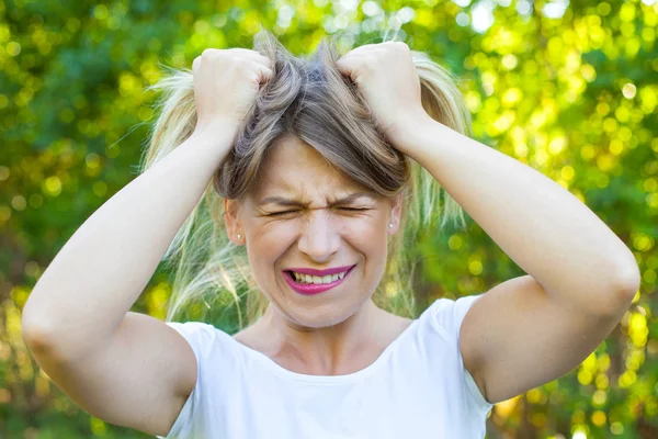 Angry young woman having a breakdown — Stock Photo, Image