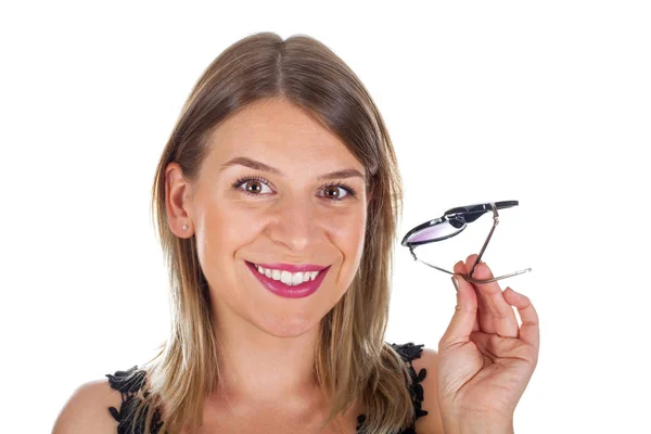 Atrakcyjna kobieta trzyma jej okulary - na białym tle — Zdjęcie stockowe