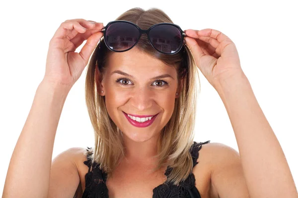 Attractive woman holding her sunglasses - isolated — Stock Photo, Image