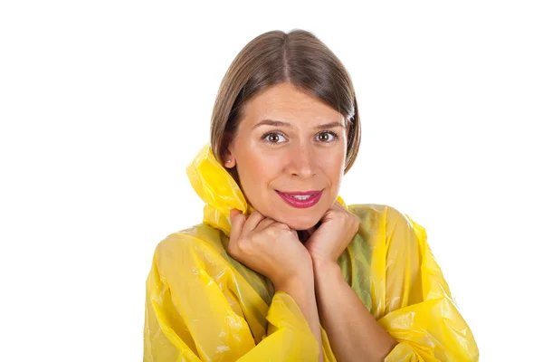 Attractive woman wearing yellow raincoat - isolated — Stock Photo, Image