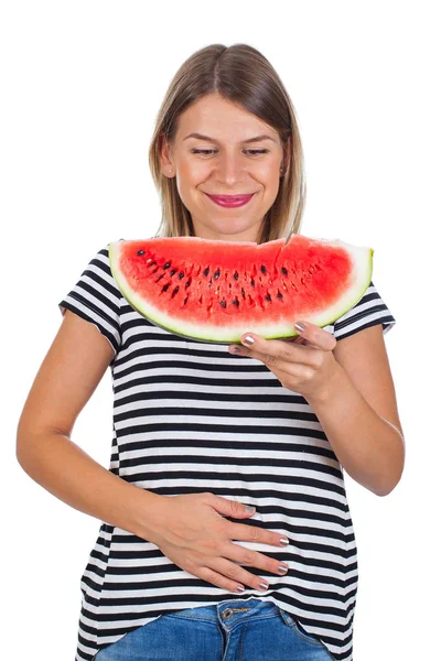 Sorrindo mulher comendo melancia & segurando seu abdômen — Fotografia de Stock