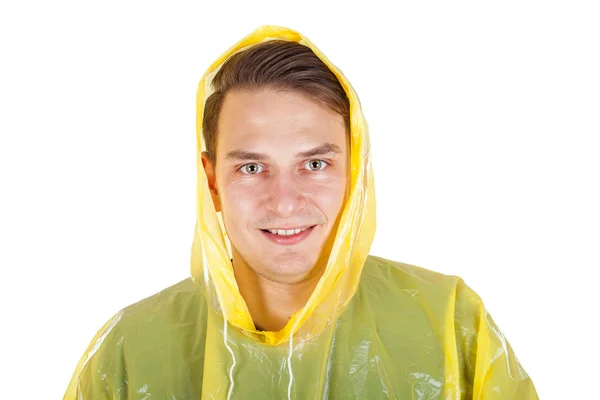 Jonge man met een gele regenjas — Stockfoto
