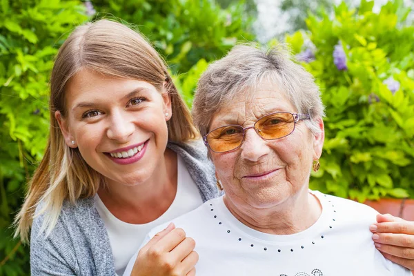 Senior lady with beautiful granddaughter — Stock Photo, Image