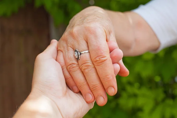 Holding hands, Parkinson disease — Stock Photo, Image