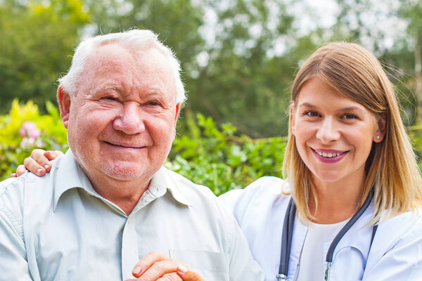 Senior man with female doctor