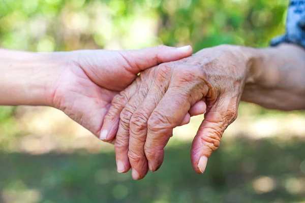 Shaking elderly hand — Stock Photo, Image