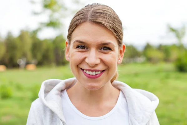 Smiling female with sporty outfit