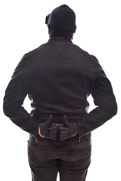 Pericoloso criminale con manette vista posteriore — Foto Stock