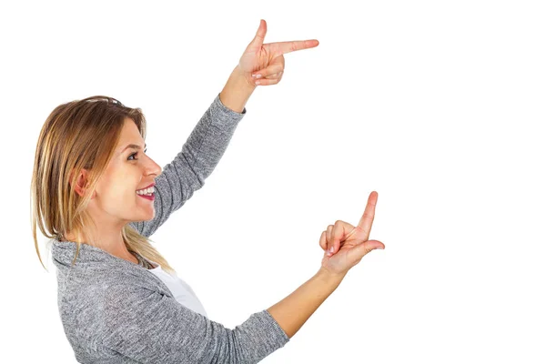 Happy woman pointing to copy space — Stock Photo, Image