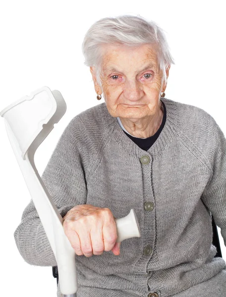 Disabled elderly woman with crutch — Stock Photo, Image