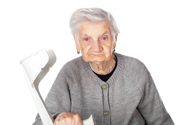 Disabled elderly woman with crutch — Stock Photo, Image