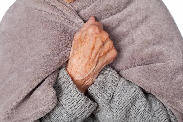 Elderly ill woman with blanket