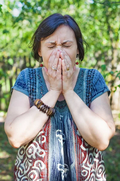 Sneezing female outdoor — Stock Photo, Image