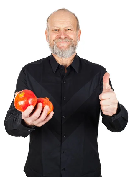 Zralé granátové jablko v rukou šťastný muž — Stock fotografie