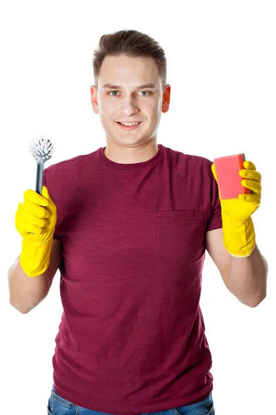 Junger Mann putzt das Haus — Stockfoto