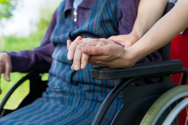 Holding hands - Parkinson disease — Stock Photo, Image