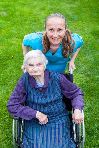 Spending time outdoor with caregiver — Stock Photo, Image