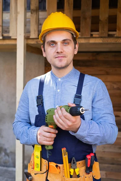 Portrait Handsome Young Craftsman Yellow Hard Hat Holding Electric Drill — Stock Photo, Image