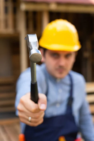 Handsome Young Repairman Holding Construction Tools Front Wooden Background — Stock Photo, Image