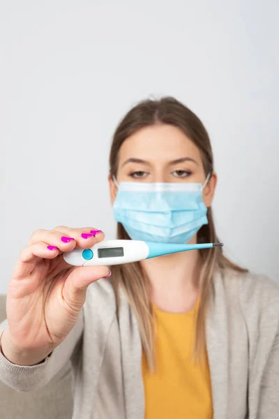 Young Woman Coronavirus Symptoms Home Wearing Mask Holding Thermometer Self — Stock Photo, Image