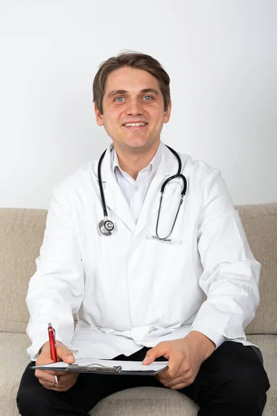 Confident Young Male Doctor Sitting Couch Office — Stock Photo, Image