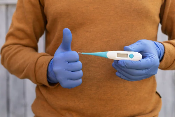 Close Picture Man Wearing Gloves Holding Digital Thermometer Showing Thumbs — Stock Photo, Image