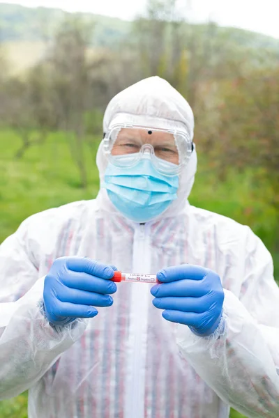 Senior Man Wearing Hazmat Suit Glasses Mask Gloves Holding Covid — Stock Photo, Image